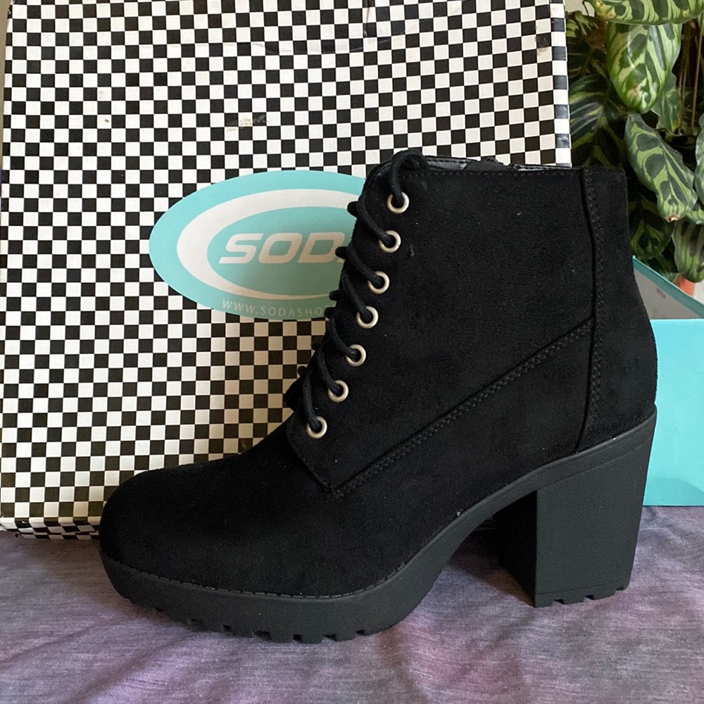 Women’s black heeled boots.